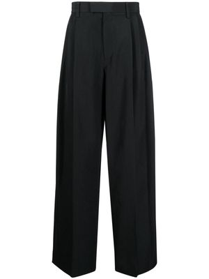Alexander Wang logo-embossed pleated trousers - Black