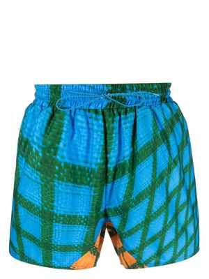 Bianca Saunders Wosh warped-pattern swim shorts - Blue