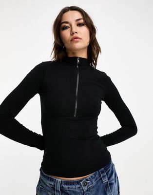 COLLUSION long sleeve funnel neck top in black